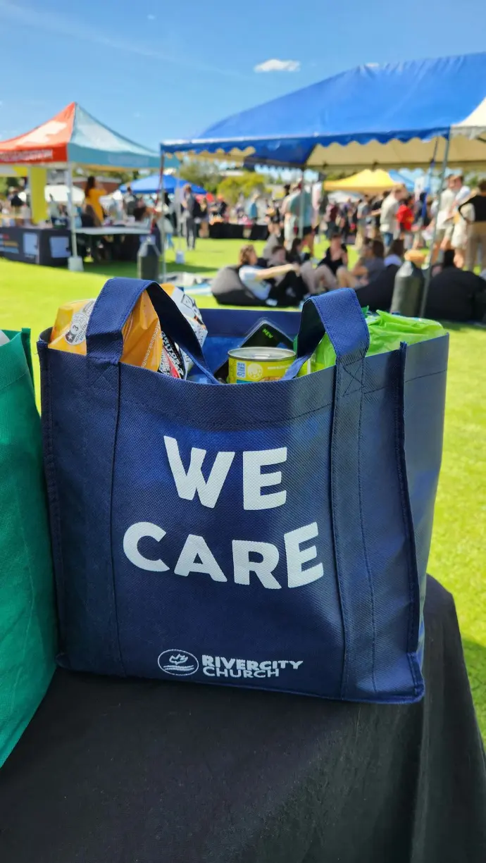 a blue tote bag sitting on top of a table